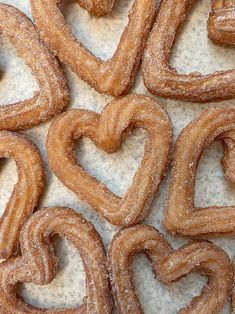 several heart shaped doughnuts sitting on top of a table