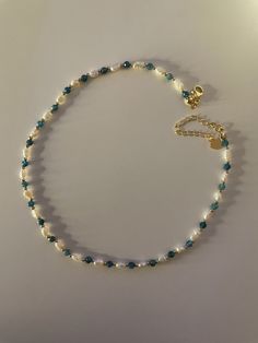 🌟 OUR DELICATE SIREN FRESHWATER PEARL NECKLACE WITH UNIQUE APATITE 🌟 HANDMADE WITH LOVE The small, delicate freshwater pearls are the focus of this elegant necklace, giving it an aura of timeless elegance and grace. The faceted apatite beads set a unique accent and represent self-confidence, communication and inspiration. The gold beads and clasp are plated with 18k gold to ensure durability and elegance. WHY OUR SIREN FRESHWATER PEARL NECKLACE WITH APATITE? ✨ Unique design of the highest qual Handmade Necklace Designs, Small Pearl Necklace, Handmade Pearl Necklace, Golden Beads, Pearl Necklace Designs, Beaded Necklace Designs, Freshwater Pearl Jewelry, Elegant Bags, Freshwater Pearl Necklace