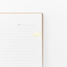 an open notebook with lined paper on top