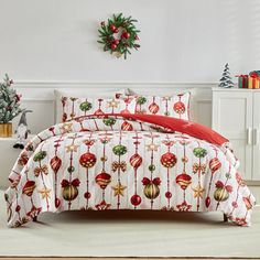 a bed with christmas decorations on it in a room