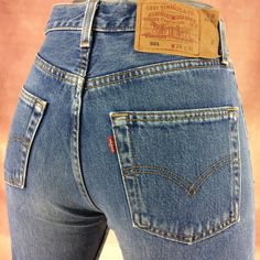 "Size 28 Vintage Levi's 501 Jeans - W28 L33 - Button Fly Jeans - 90' Jeans Slim Fit Tapered Leg - Red Tab - Made in USA, waist 28\" Medium Brand: LEVIS 501 Size On Tag marked W29 L32 but fits more like 28\" waist, 11.75\" rise, 23.5\" thighs, 42\" hips, 33\" inseam, 14.5\" leg opening! Fits a size 28, but check your measurements and compare the measurement with your garment. (see full measurement below) Recommended waist size: 28\" (28x33) *size 28 for a waist of 28 inches, expect your jeans to measure about 14\" across at the waist (Doubled 28\") to fit. Please follow our measurement guide: https://www.instagram.com/p/B2o273Kl5Oi/?igshid=1q5azikfj59p4 Material :  Cotton 100% Made In USA Measurements:- All measurements are taken with the garment laying flat, doubled for the Waist, hip &, e Vintage Fitted Jeans With Button Closure, Vintage Mid-rise Jeans With Buttons, Red Fitted Vintage Jeans, Fitted Vintage Red Jeans, Levis 501 Women, Levi 501 Jeans, Levis 501 Jeans, Levis Vintage, Levi Jeans Women