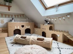 there are two beds made out of cardboard boxes and one is in the shape of a castle