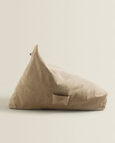 a brown bag sitting on top of a white floor