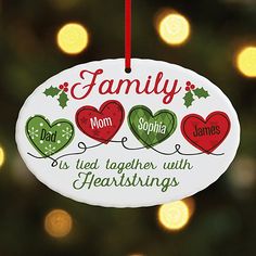 a family ornament hanging from a christmas tree