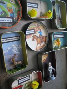 there are many magnets on the wall that have pictures and toys attached to them