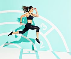 a woman running on a blue and white background