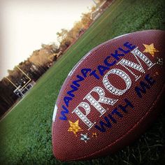 a football sitting on top of a lush green field