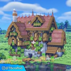 a very cute looking house in the middle of some grass and water with plants growing on it