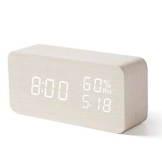 an alarm clock with white numbers on the front and back sides is shown in this image