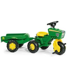 a green and yellow toy tractor on a white background