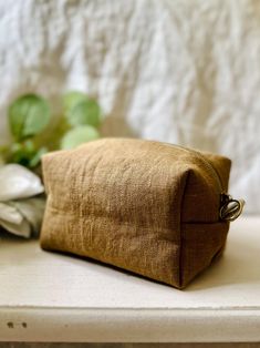 These linen cosmetic bags are handmade with 100% Oeko-Tex linen. They come with 4 different sizes. They are elegant and very durable. They are machine washable.  Dimensions: Mini ~ 5"L x 3"W x 2.8"H S ~ 5.5"L x 3"W x 3.5"H M ~ 7"L x 4"W x 3.5"H L ~ 9"L x 5"W x 3.5"H Feel free to reach out if you have any questions. Minimalist Makeup Bag, Gifts For Mom Birthday, Mom Birthday Gifts, Bridesmaid Makeup Bag, Handmade Makeup, Minimalist Makeup, Bag Minimalist, Bridemaids Gifts, Bridesmaid Makeup