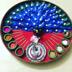 a decorative plate with peacock decorations on it