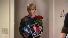 a young man is holding flowers and pictures