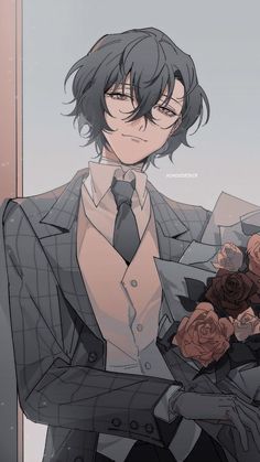 a man in a suit and tie holding flowers