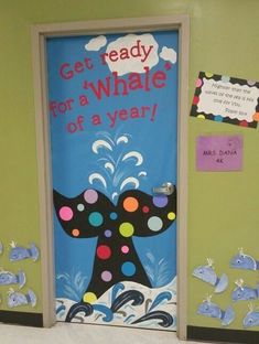 an image of a door decorated with magnets and paper cutouts that say get ready for a whale of a year