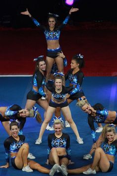 a group of cheerleaders standing on top of each other