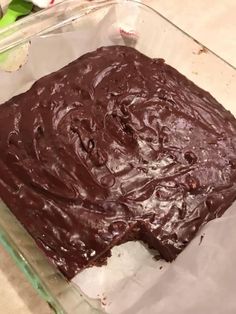 a chocolate cake sitting in a glass dish