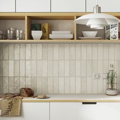 a kitchen with white cupboards and shelves filled with dishes on top of each other