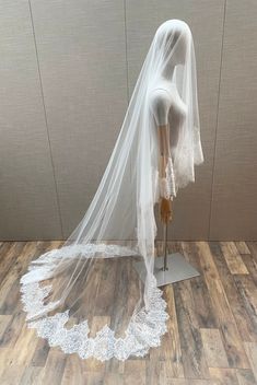 a mannequin with a veil on top of it