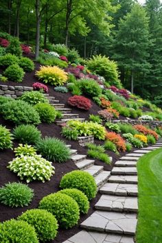 a hillside garden with stone steps leading up to it