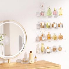 there is a mirror on the wall next to a dresser and shelves with perfumes