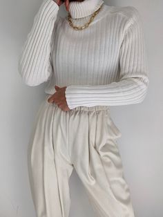 Classic 90s turtleneck in a ribbed cotton fabric. Turtleneck has a fitted look with our favorite raglan seams. Tag reads energie White Ribbed Fitted Turtleneck, Chic Beige Ribbed Turtleneck, Trendy White Turtleneck For Spring, Stretch Ribbed White Turtleneck, Chic Spring Turtleneck With Ribbed Cuffs, Spring Chic Turtleneck With Ribbed Cuffs, Cream Ribbed Turtleneck For Winter, Ribbed Turtleneck For Spring, White Stretch Turtleneck For Spring