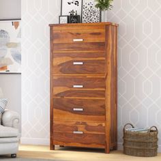 a wooden chest of drawers in a living room