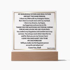 a wooden frame with a poem written in white and gold on the front, along with an image of a man's face