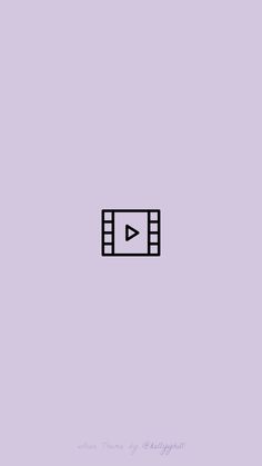 a purple wall with an arrow pointing to the left and a video play button on it