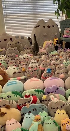 a pile of stuffed animals sitting next to each other