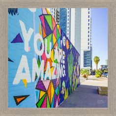 there is a mural on the side of a building that says you're amazing