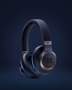 the jbl headphones are on display against a dark background