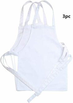 three white aprons with straps on each side