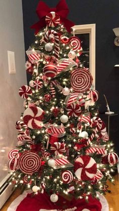 a christmas tree decorated with red and white candy canes