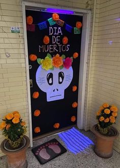 a door decorated with flowers and a skeleton