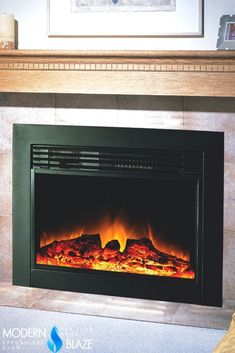 an electric fireplace in a living room with the fire burning brightly on it's side