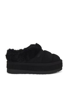 Find UGG Tazzlita Slipper on Editorialist. UGG Tazzlita Slipper in Black Quilted suede upper with rubber lug sole. Made in Vietnam Fur origin: Australia. Pull-on styling. Faux fur lining Dyed lamb collar. Uggplush ™ vamp lining and sockliner. Round toe. Water repellent. Approx 45mm/ 1.75 inch platform. UGGF-WZ67. 1146390. About the designer: Ugg Tazzlita, Kappa Slides, Chunky Slippers, Month Workout, Pretty Shoes Sneakers, Shoe Wishlist, Uggs Outfit, Winter Fit, Fall Wear