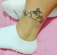 a woman's foot with a tattoo on her ankle and the word, i love you