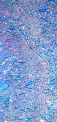 an abstract background with blue and white lines in the center, as well as glitter