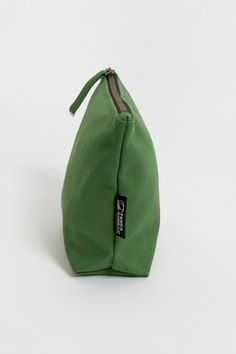 If you’ve been looking for an eco-friendly makeup bag to tame and organize cosmetic items, consider the simple and affordable Lok Pouch. Your purchase also supports Feeding America's campaign to end hunger by helping donate meals to kids and families in need. Size:  7"(H) x 9"(W) x 3"(D) Opening: 7 inches Made with 14-oz Certified Fairtrade Organic cotton canvas Long pull zipper YKK lead-free antique finish metal zippers All the accessories including zippers and fasteners are lead-free Made in a Eco Friendly Makeup, Feeding America, Green Makeup, Cosmetic Items, Changing Mat, Antique Finish, Moss Green, Makeup Bag, Cotton Canvas