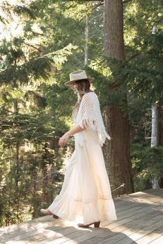 "Cozy 1970's white open knit acrylic blend shawl with fringe. Beautiful lattice crochet.  In great vintage condition. Light wear - no major flaws.  Measurements:  Fits an array of sizes Width: 60\" Length: 23\" + 5\" fringe For reference, model is 5'9\" 34/30/42 All measurements are taken flat and then doubled when appropriate. Please let us know if you have any questions about sizing or fit. Please check out the shop policies and feel free to contact us with any questions. https://www.etsy.com/shop/SurfandtheCity/policy?ref=shopinfo_policies_leftnav You can view more of our vintage dresses here:  https://www.etsy.com/shop/SurfandtheCity?section_id=14724213&ref=shopsection_leftnav_1 Continue Shopping at Surf and the City:  https://www.etsy.com/shop/SurfandtheCity Keep in touch! INSTAGRAM / Bohemian Open Knit Shawl, Bohemian Crochet Lace Shawl For Spring, Bohemian Beige Crochet Lace Shawl, Cream Bohemian Shawl For Spring, Bohemian Cream Lace Shawl, Bohemian Cream Poncho With Fringe, Bohemian Lace Shawl In Cream, Bohemian Cream Crochet Lace Shawl, Bohemian Lace Shawl In Cream Color