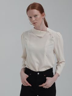 Editor's NotesUnique design asymmetrical detail collar puff sleeve design blouse top. This has a casual and classy mood that is great to style in a casual and formal way with various of outfits.- Unique detail pointed blouse top- Chic and feminine silhouette when worn- Natural drape like silhouette design wear- Great to style in various of luxurious waysMeasurements(in.)One Size (XS-M)- Total Length: 23.43 in.- Shoulder: 14.80 in.- Chest: 37.13 in.- Hem: 40.31& Chic Evening Blouse With Pleated Sleeves, Classic Structured Formal Tops, Classic Fitted Tops With Pleated Sleeves, Evening Tops With Structured Shoulders And Long Sleeves, Long Sleeve Tops With Structured Shoulders For Evening, Elegant Formal Blouse With Structured Shoulders, Timeless Collared Tops For Work, Chic Formal Blouse With Structured Shoulders, Chic Structured Formal Tops