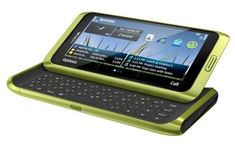 a green cell phone with a keyboard on it's side and an open screen