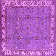 a purple rug with an intricate design on the center and bottom, is shown in full view