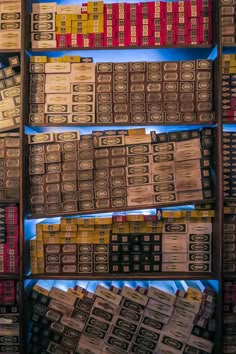 rows of wooden boxes are stacked on top of each other in a store display case