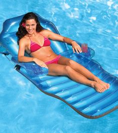 a woman laying on an inflatable pool float