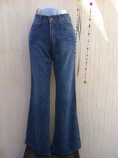 A beautiful vintage bell botom jeans Lois perfect for a boho festival  look with your favourite boots or platforms and a hat.Made in Spain in early 90s,is in excelent vintage condition(never used;new ítem,old stock). Everything at VintageBeachHut has been carefully washed or dry cleaned and it is ready to wear.    Measurements are taken flat in inches (and centimetres); bust and waist already doubled: Waist:26,77 inches(68 cm) Hips:16,53 inches (42 cm) Lenght:42,91 inches(109 cm) Inseam:32,67 in Wide Leg Summer Festival Jeans, Summer Festival Wide Leg Jeans, Wide Leg Jeans For Summer Festivals, Hippie Straight Leg Jeans For Fall, Hippie Wide Leg Jeans For Fall, Fall Festival Straight Leg Jeans, Wide-leg Jeans For Fall Festival, Straight Leg Jeans For Festival In Fall, Straight Leg Jeans For Fall Festival