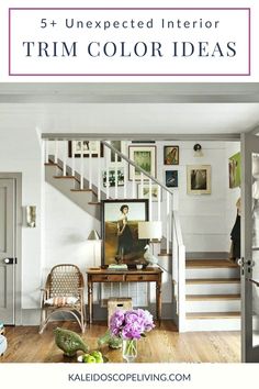 a living room with white walls and stairs in the background is an image of a staircase