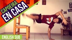 a person doing a handstand in front of a chair with the words capoeira en casa on it