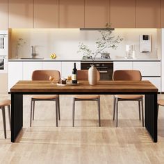 a table with four chairs around it in the middle of a kitchen and dining room